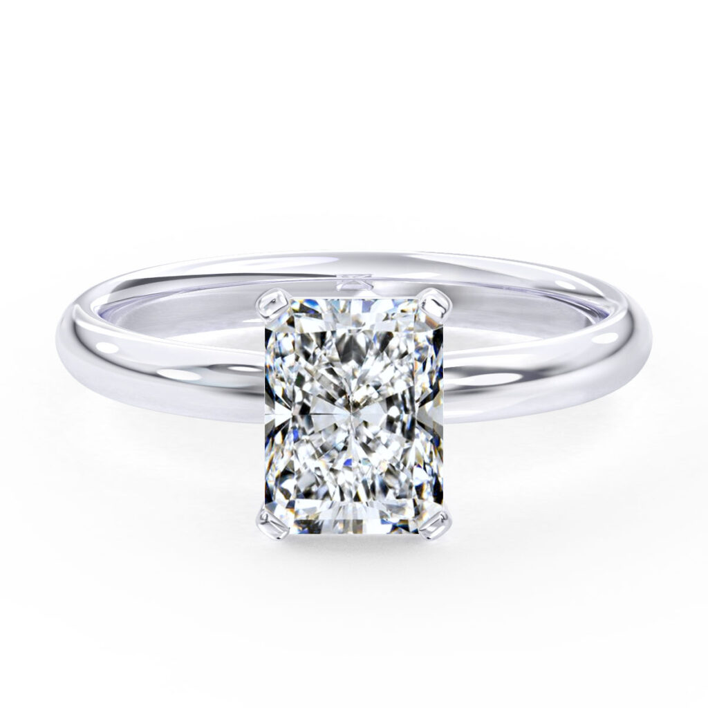 Radiant-cut moissanite solitaire engagement ring set in a sleek white gold band, showcasing a timeless and modern design with exceptional brilliance.